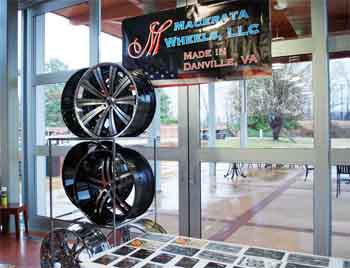 A display of custom wheels that will soon be made in Danville by Macerata Wheels. 